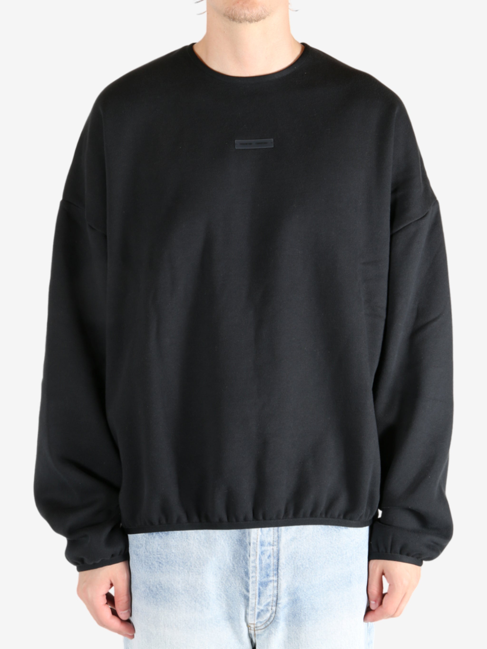  Black tops worn by a person, showing the tops fit