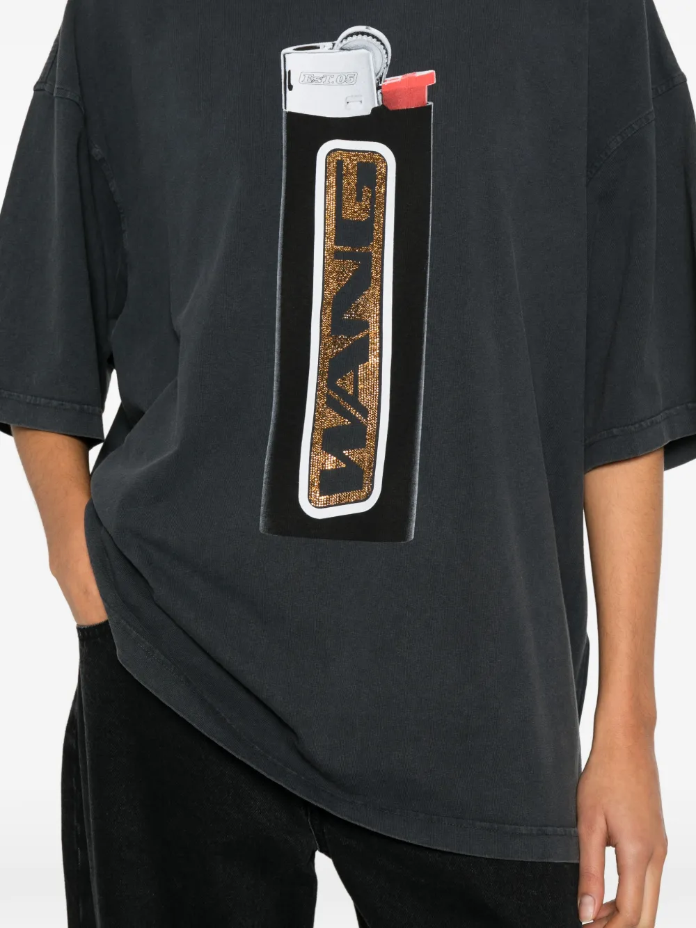 Close up of black shirts, showing texture of the cotton fabric