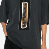 Close up of black shirts, showing texture of the cotton fabric