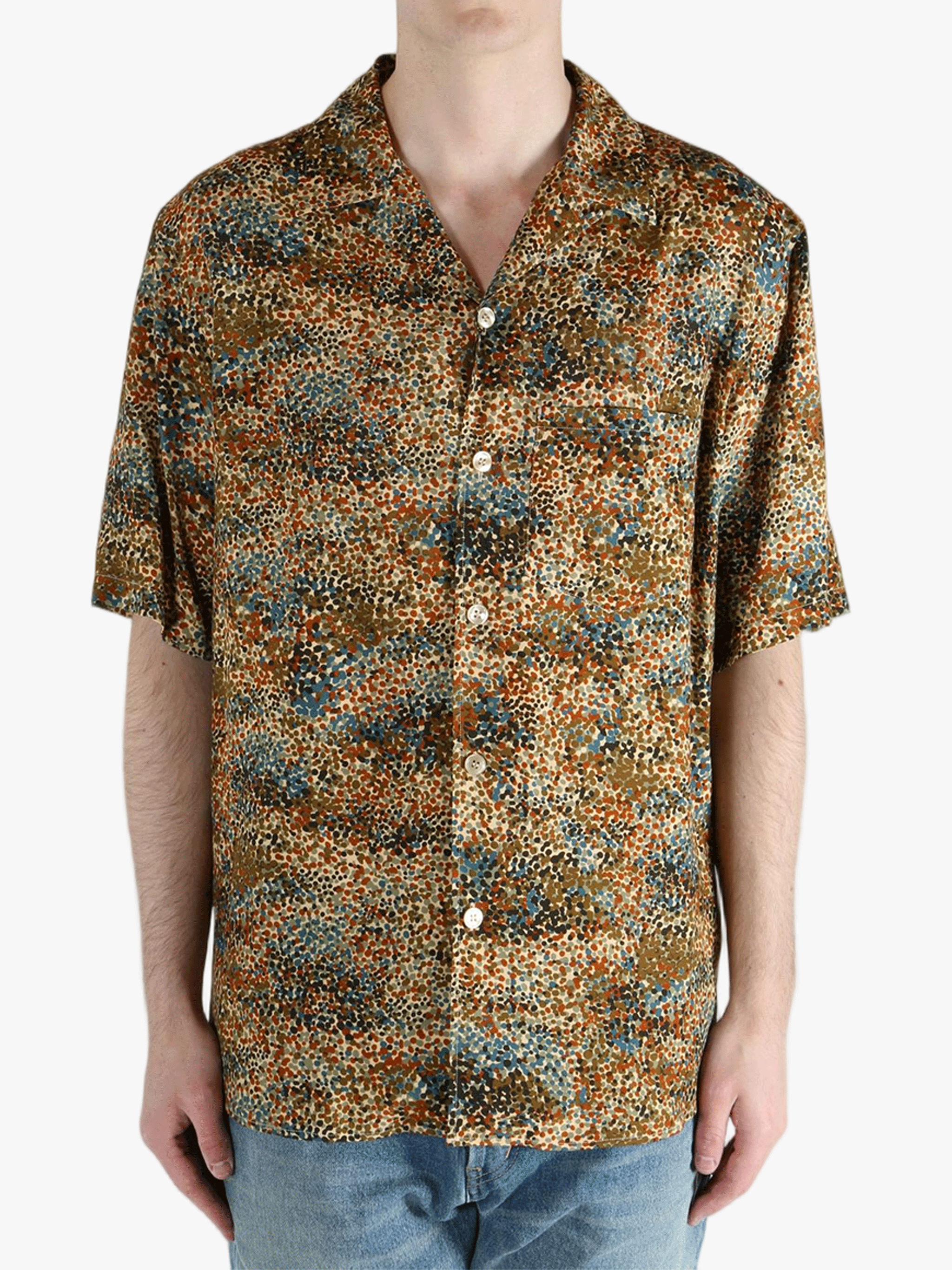 Tan shirt worn by a person, showing the fit