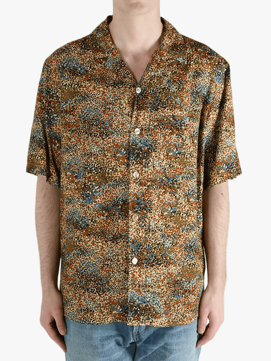 Tan shirt worn by a person, showing the fit