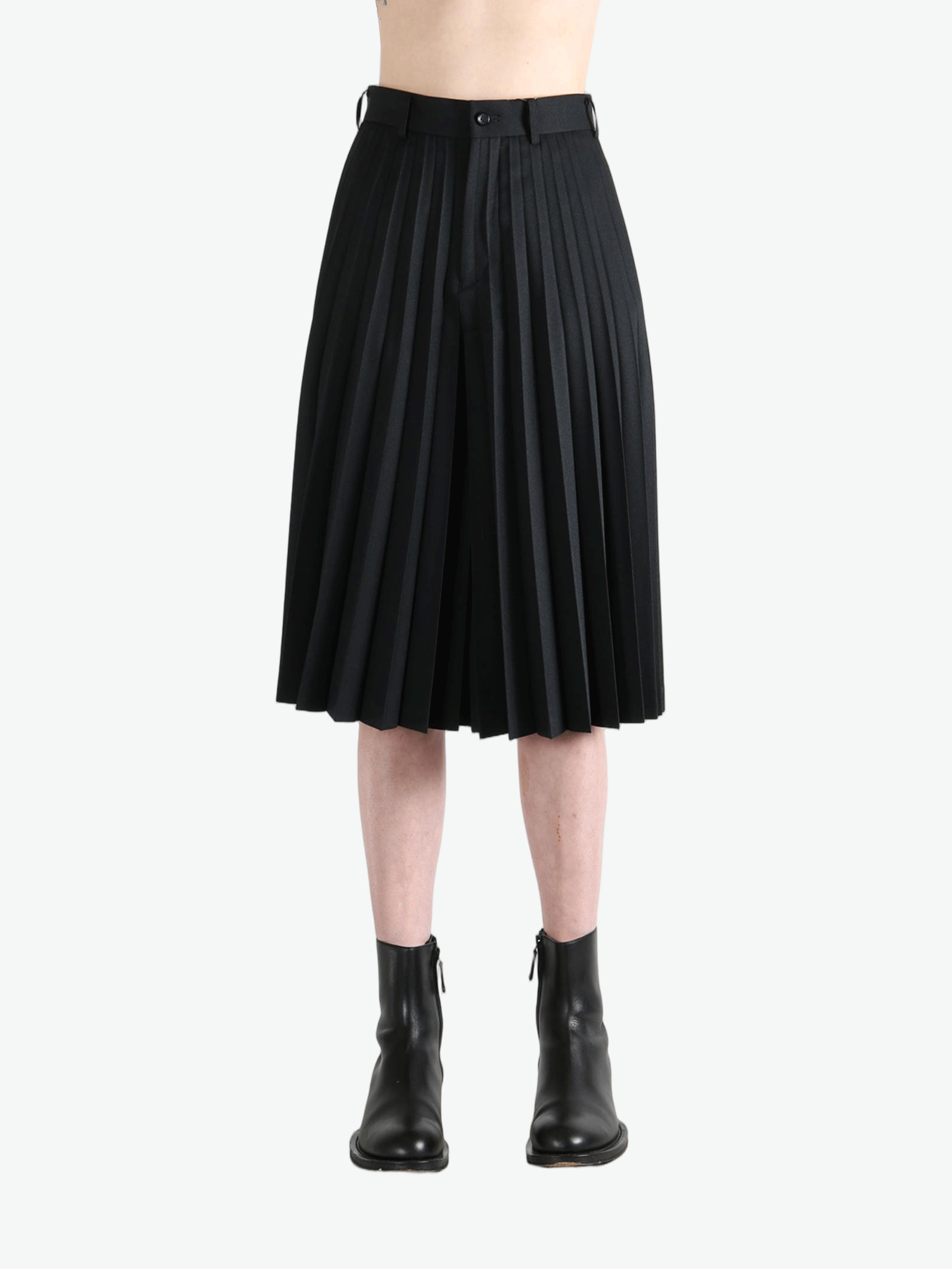 black pants worn by a person, showing the pants  fit