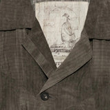 Close up of brown jacket, showing texture of the viscose fabric