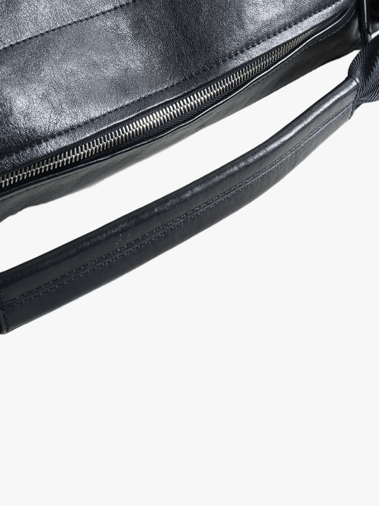 Close up of black bag, showing texture of the leather fabric