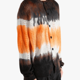 Orange cardigan worn by a person, showing the cardigan's fit