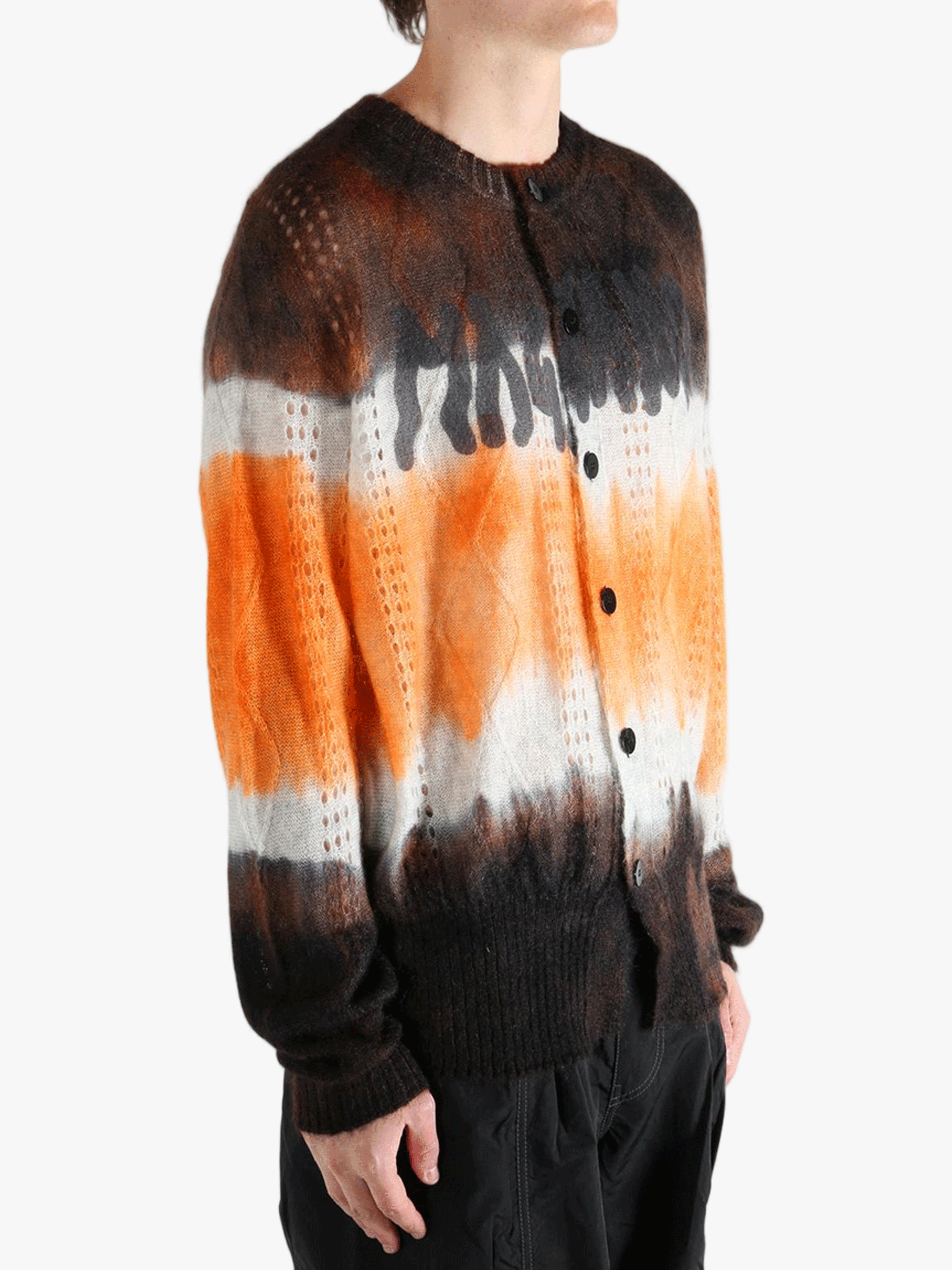 Orange cardigan worn by a person, showing the cardigan's fit