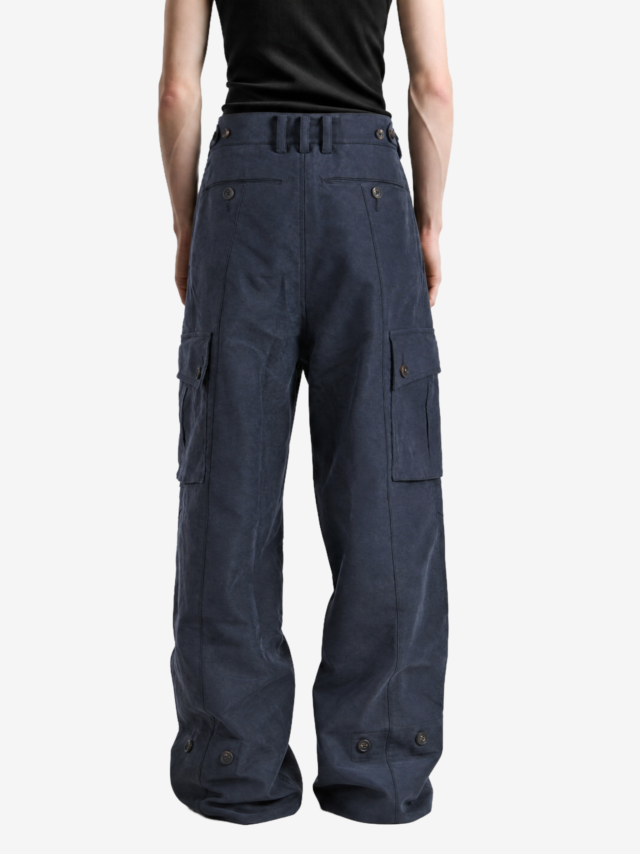 Navy pants worn by a person, showing the pants fit
