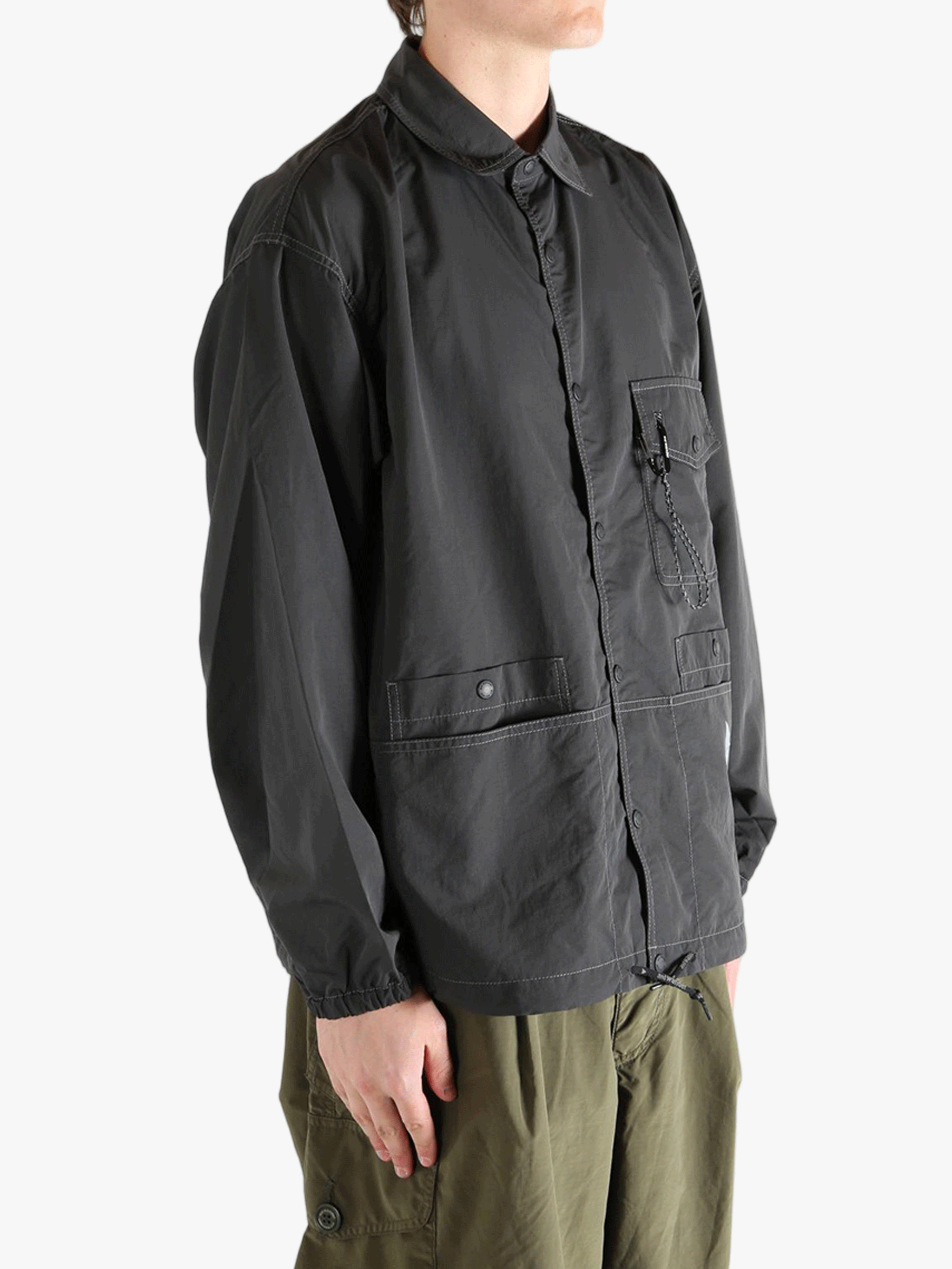 Black jacket worn by a person, showing the  jacket's fit