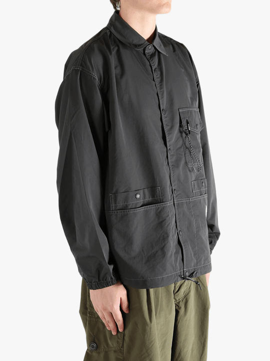 Black jacket worn by a person, showing the  jacket's fit