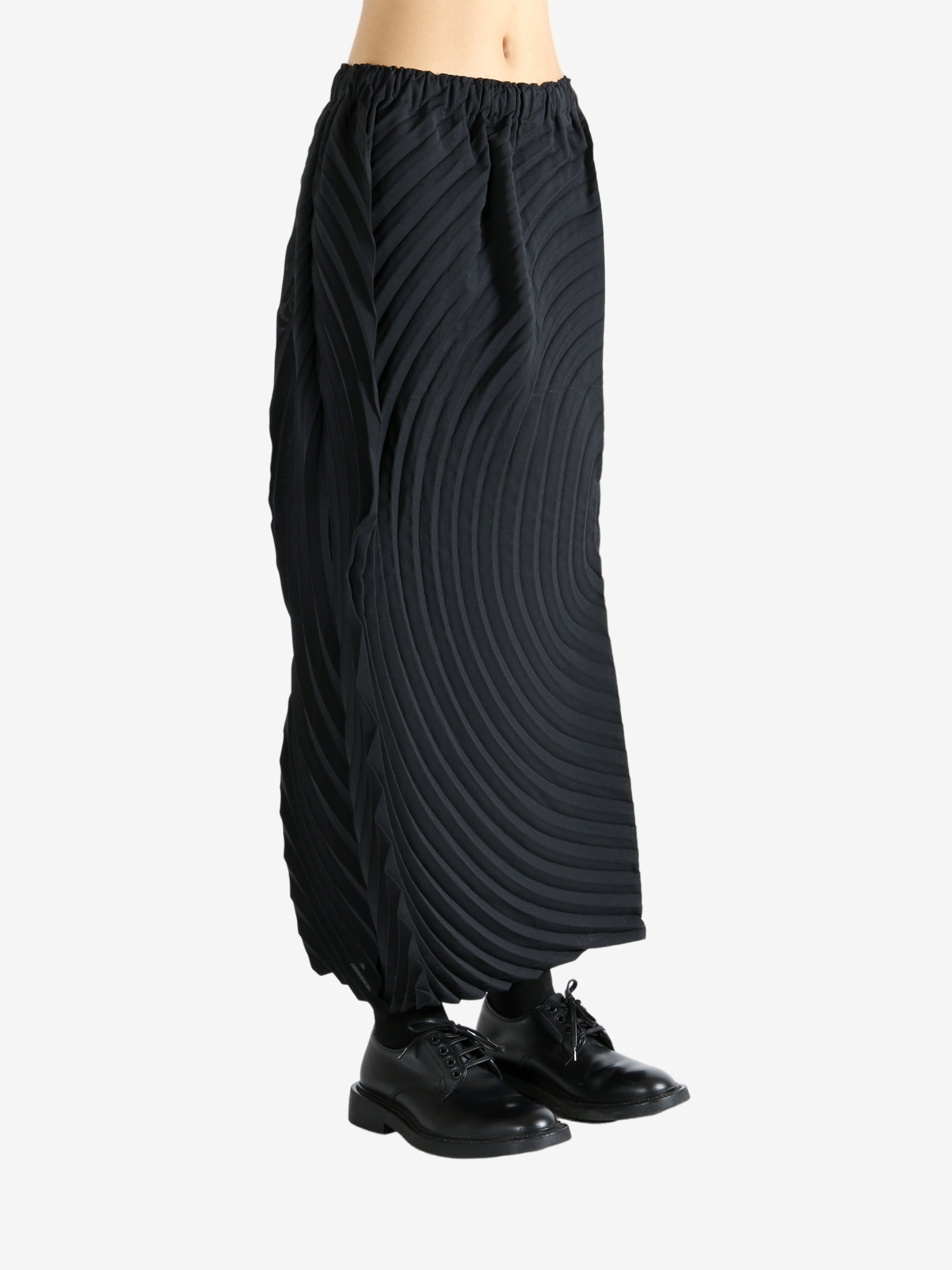 Black skirt worn by a person, showing the skirt's fit