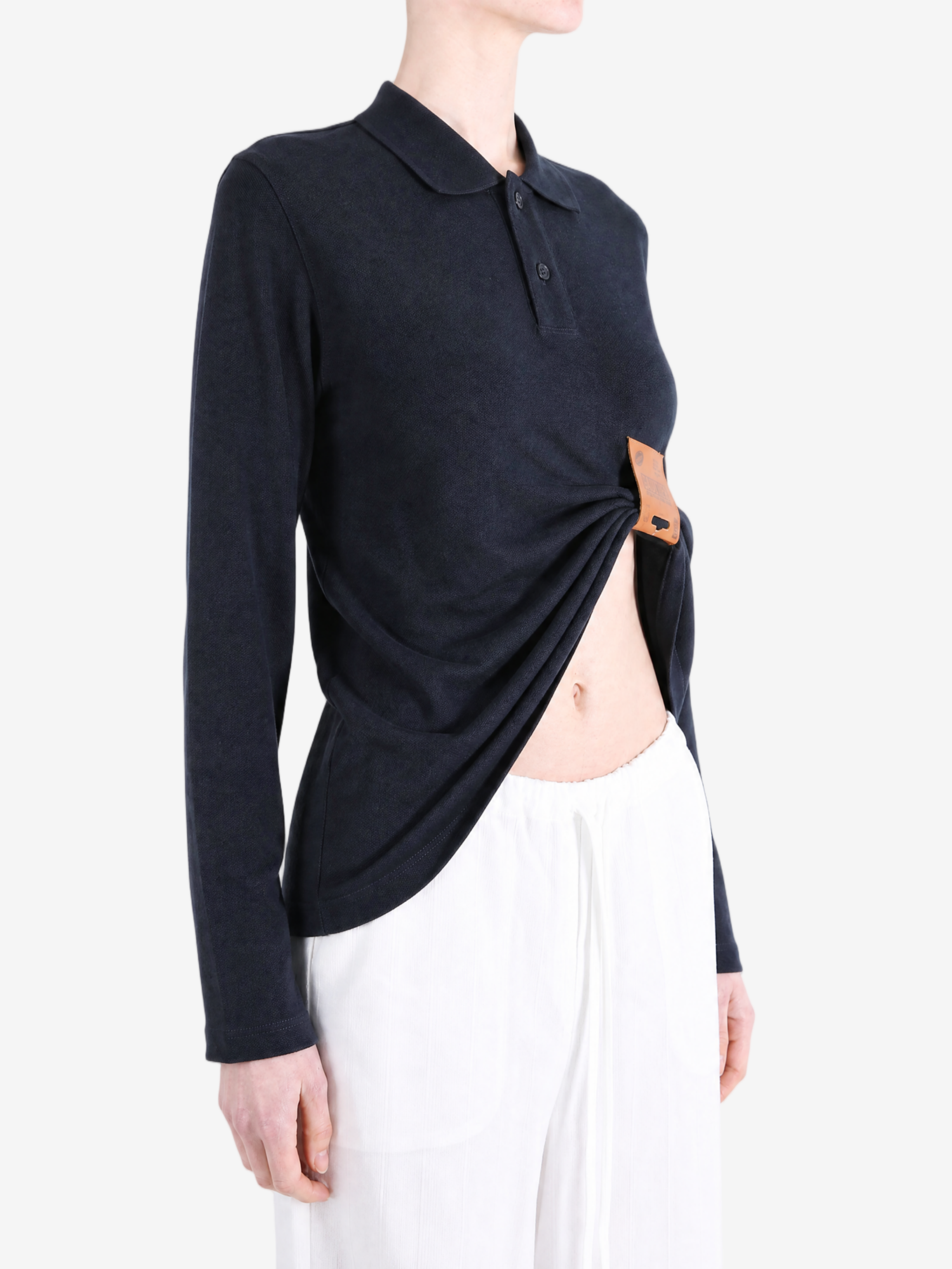 Navy top worn by a person, showing the top fit