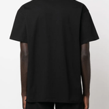 Black t-shirt worn by a person, showing the shirt's fit