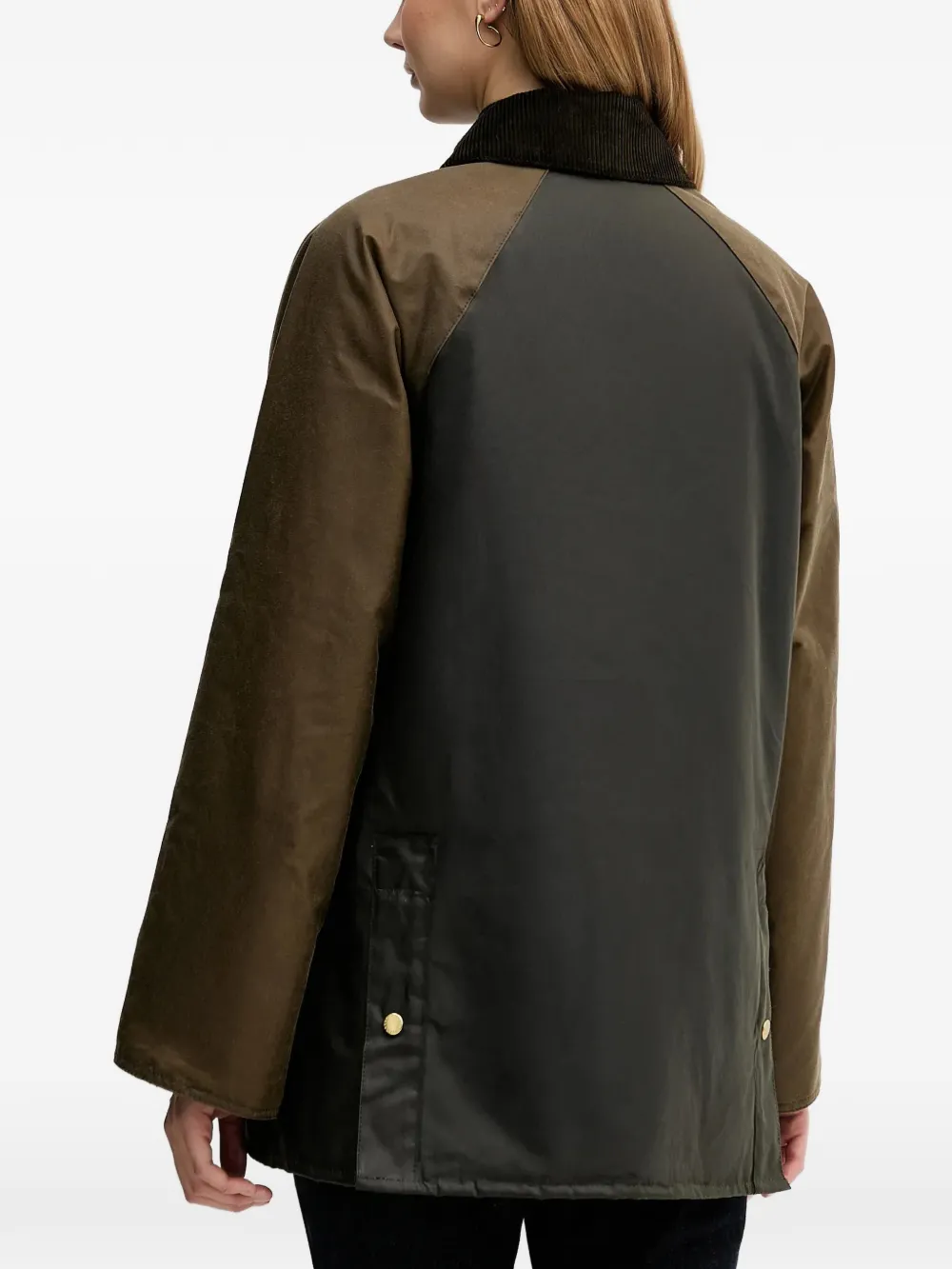 Brown jacket worn by a person, showing the jacket fit
