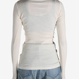 White T-shirt worn by a person, showing the shirt's fit