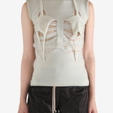 White top worn by a person, showing the top's fit