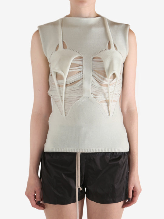 White top worn by a person, showing the top's fit