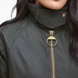 Green jacket worn by a person, showing the jacket fit