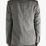 Grey jacket worn by a person, showing the jacket's fit