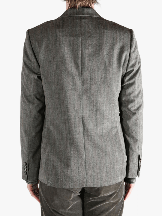 Grey jacket worn by a person, showing the jacket's fit