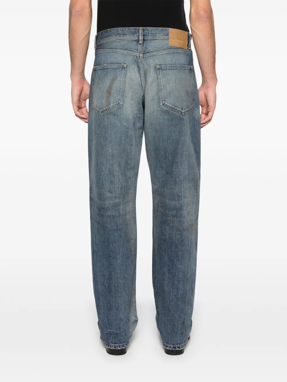 Blue jeans worn by a person, showing the jeans fit