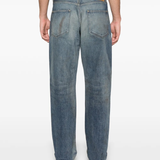 Blue jeans worn by a person, showing the jeans fit