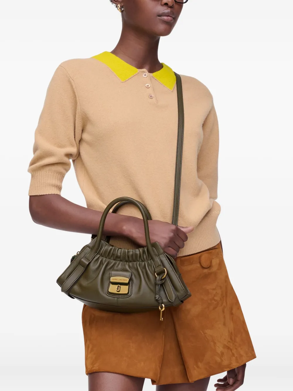 Green bags worn by a person, showing the bags fit