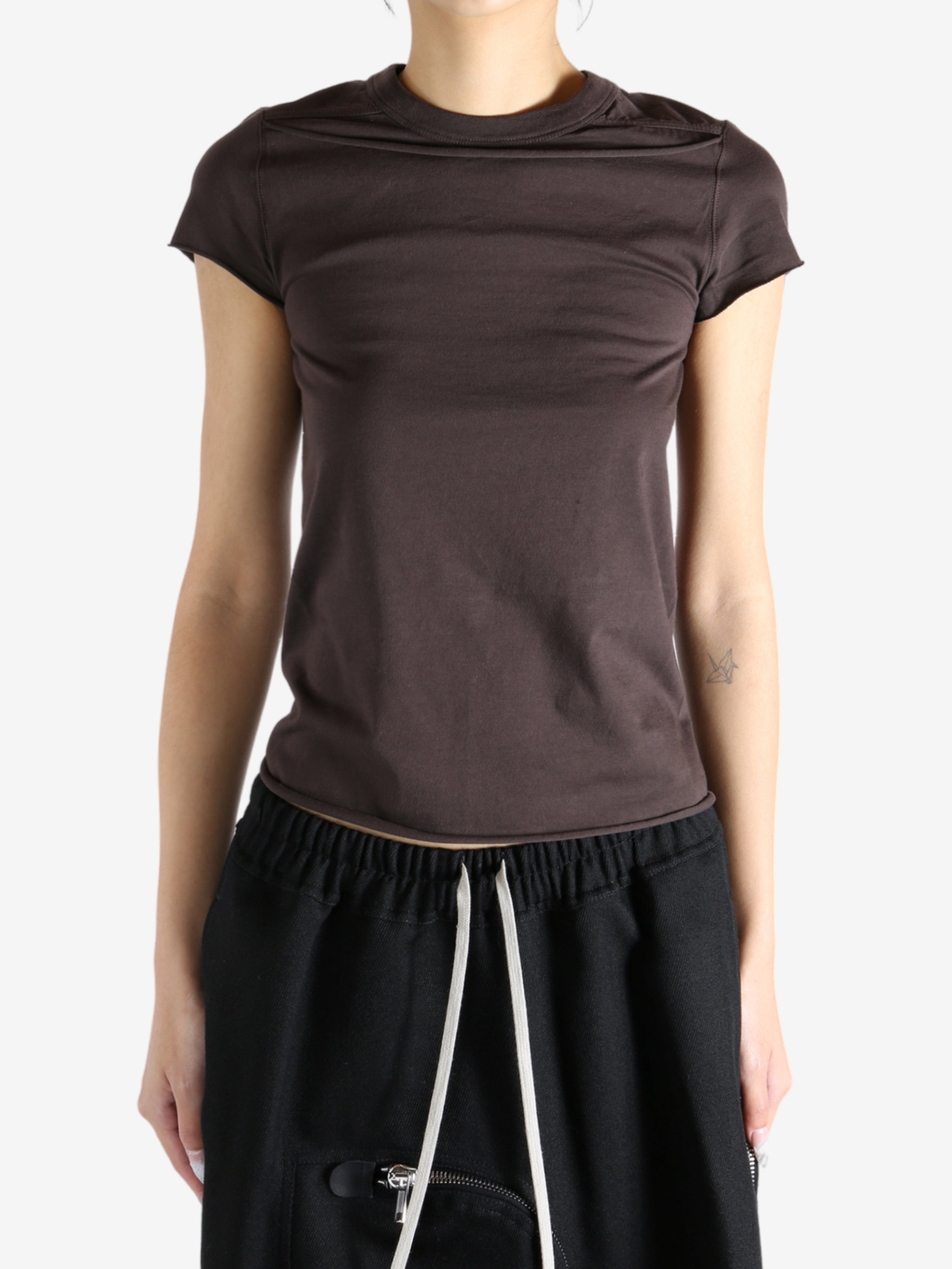 Brown shirt worn by a person, showing the shirt fit