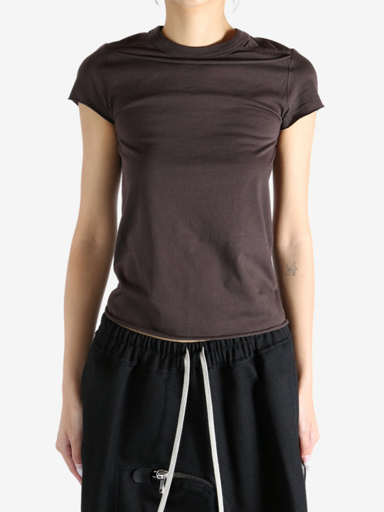 Brown shirt worn by a person, showing the shirt fit