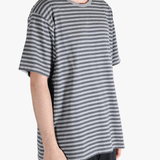 Grey t-shirt worn by a person, showing the t-shirt fit