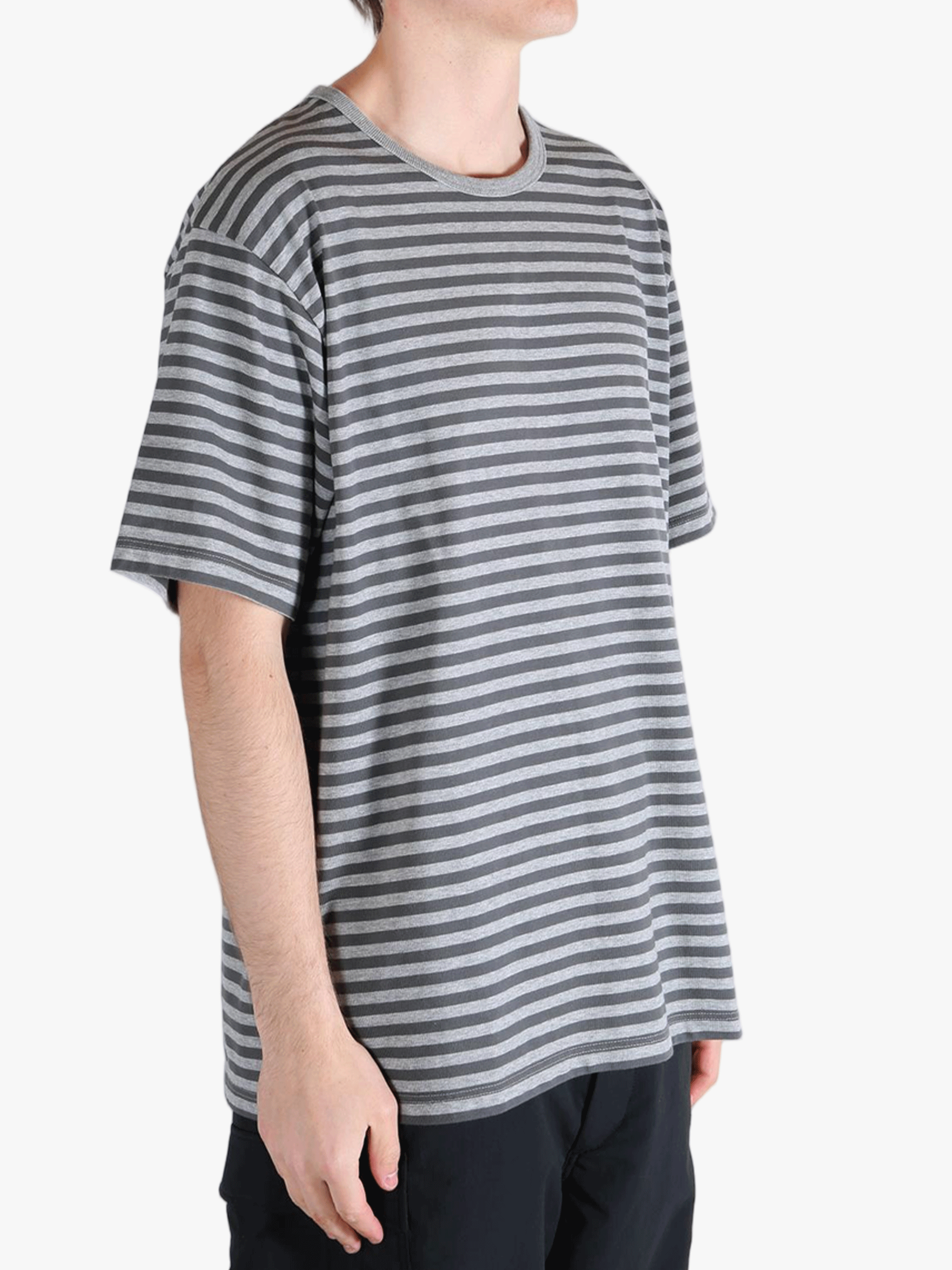 Grey t-shirt worn by a person, showing the t-shirt fit