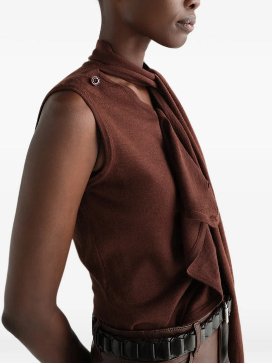 Brown top worn by a person, showing the top fit