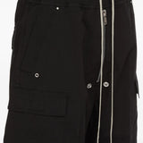 Black pants worn by a person, showing the pants fit
