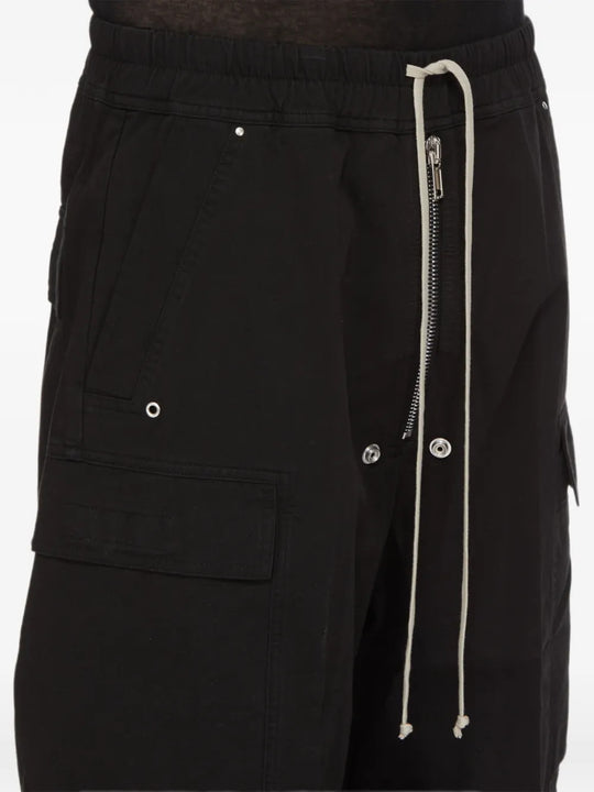 Black pants worn by a person, showing the pants fit