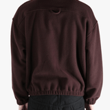 Brown hoodie worn by a person, showing the hoodie 's fit