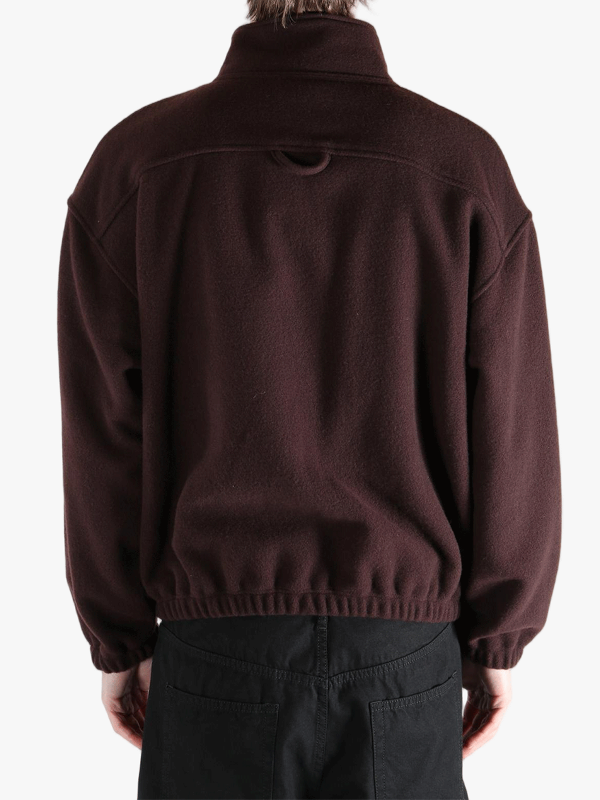 Brown hoodie worn by a person, showing the hoodie 's fit