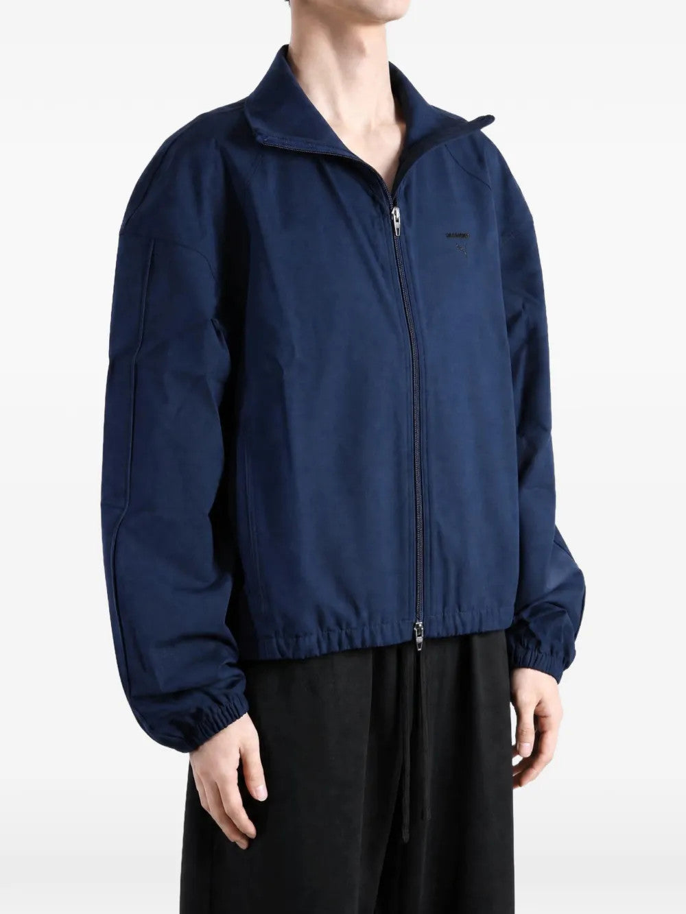 Navy jacket worn by a person, showing the jacket fit