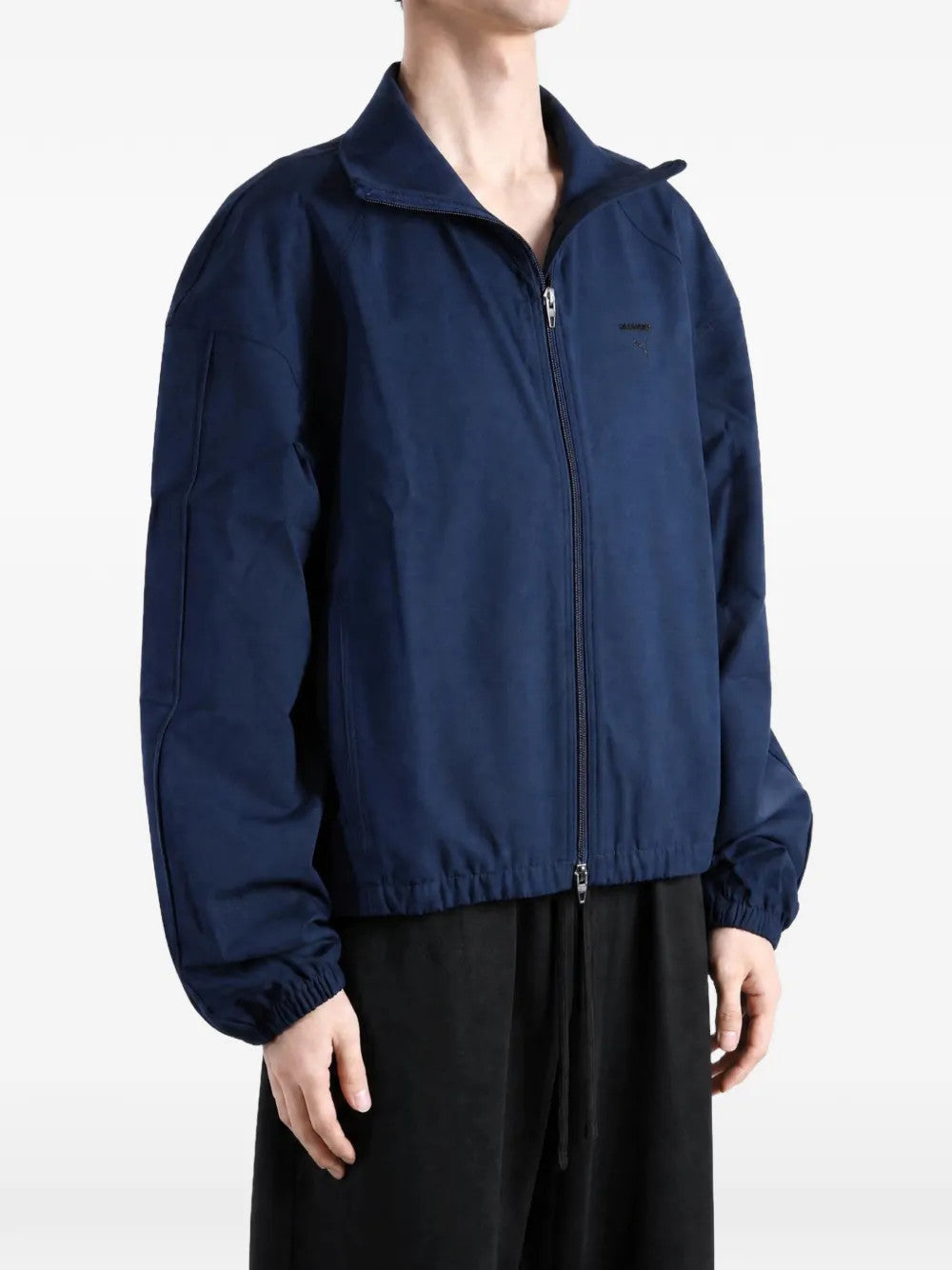 Navy jacket worn by a person, showing the jacket fit