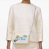 White bag worn by a person, showing the bag fit