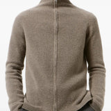Brown knitwear worn by a person, showing the knitwear fit
