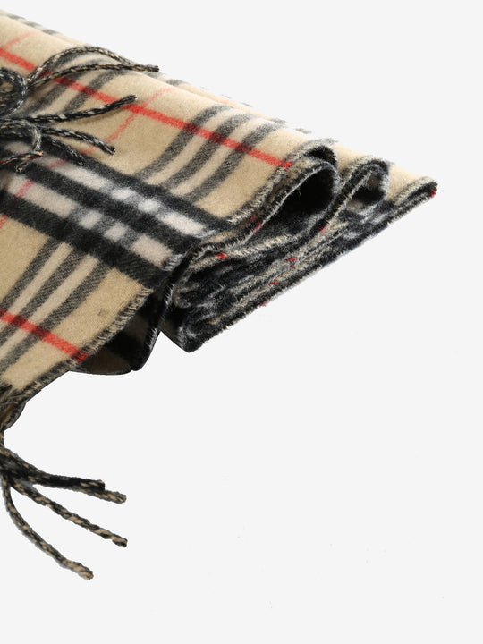 Close up of tan scarves, showing texture of the fabric