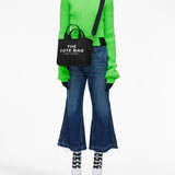 Black bag worn by a person, showing the bag's fit