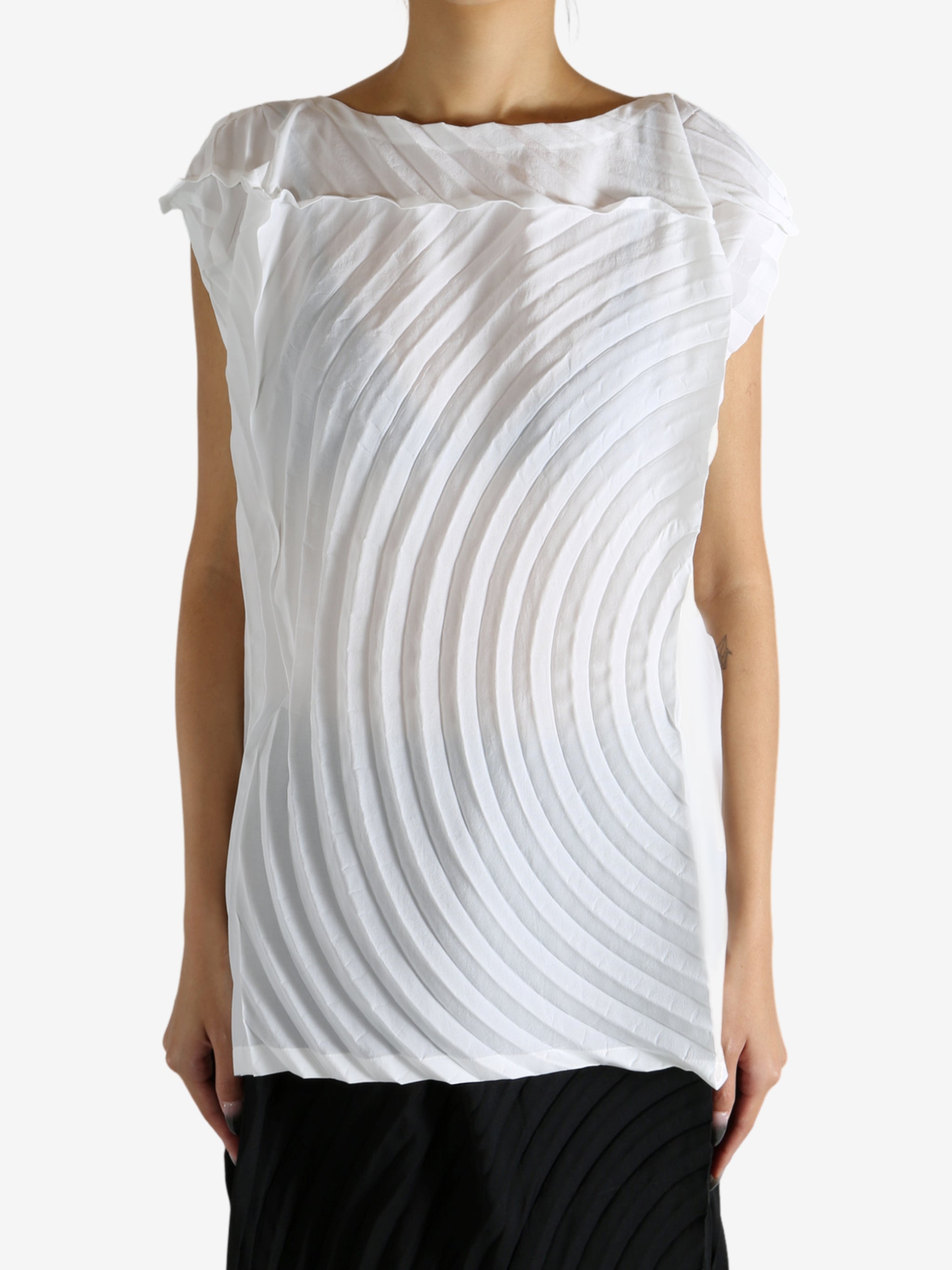 White shirt worn by a person, showing the shirt's fit