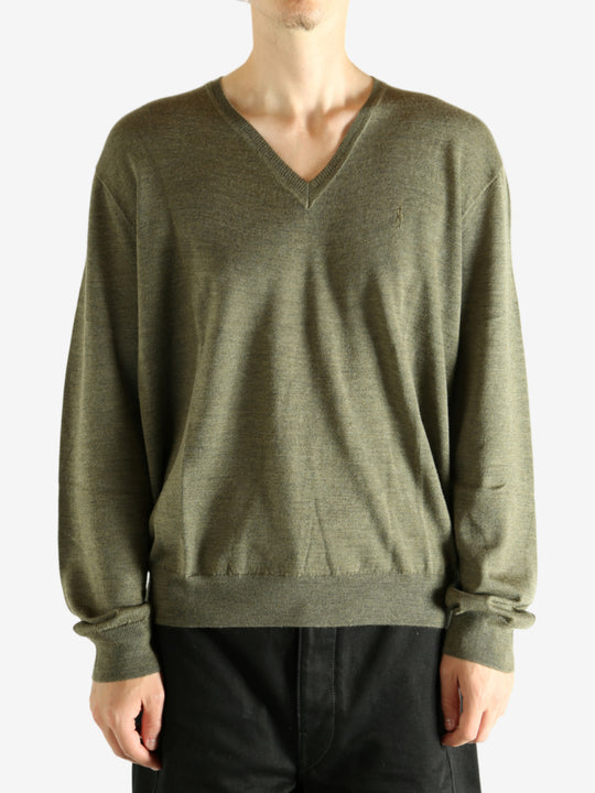 Green sweater worn by a person, showing the sweater's fit