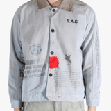 Grey jacket worn by a person, showing the jacket's fit