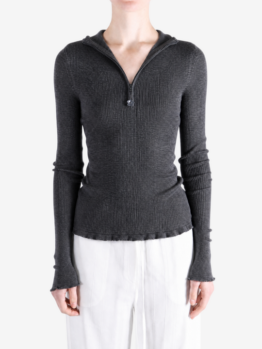 Grey hoodie worn by a person, showing the hoodie fit