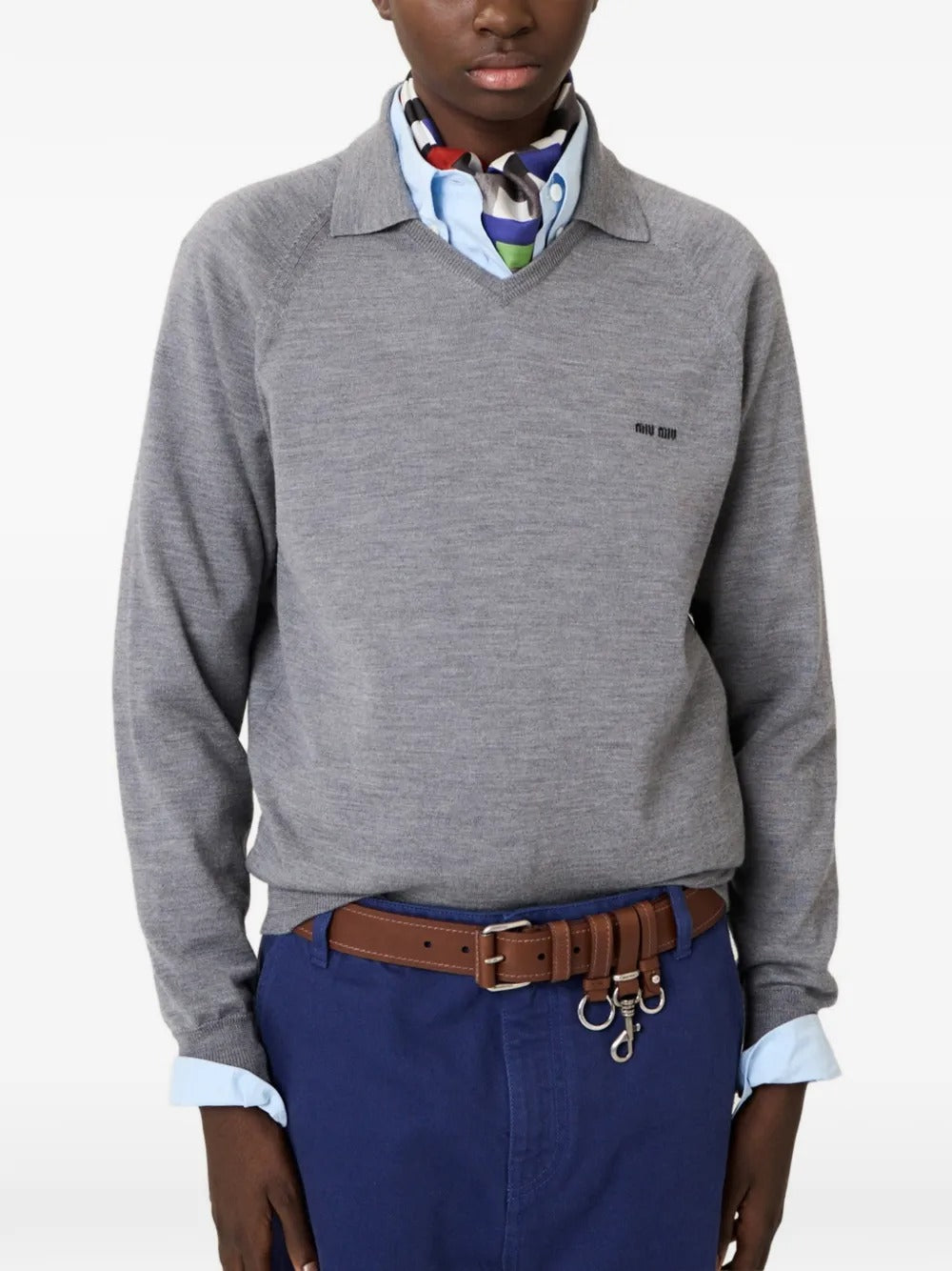 Grey knitwear  worn by a person, showing the knitwear's fit