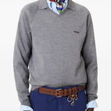 Grey knitwear  worn by a person, showing the knitwear's fit