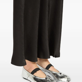 Grey shoes worn by a person, showing the shoes fit