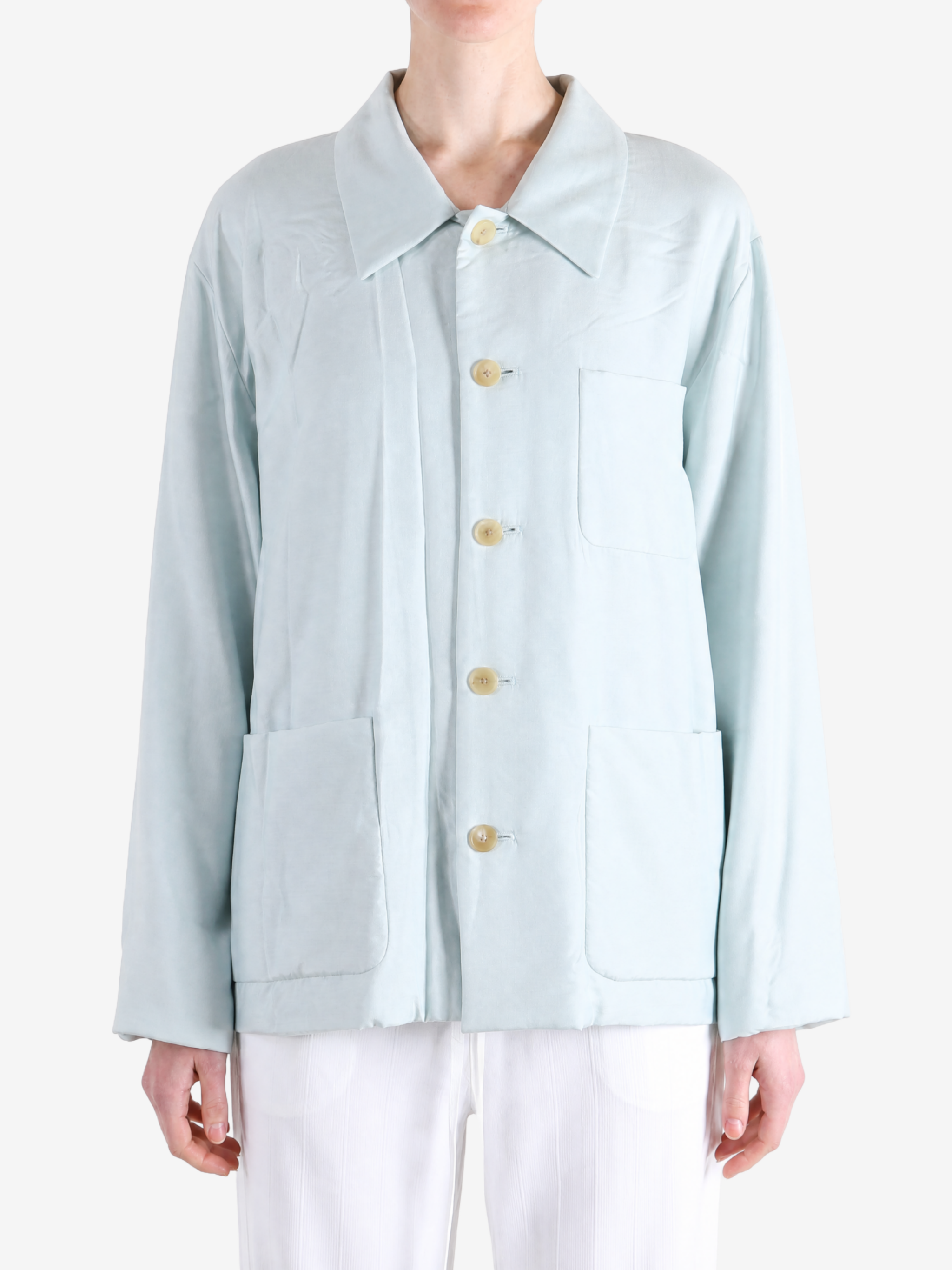 Blue jacket worn by a person, showing the jacket fit