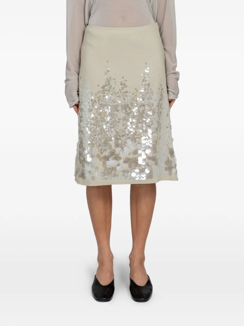Tan skirts worn by a person, showing the skirts fit